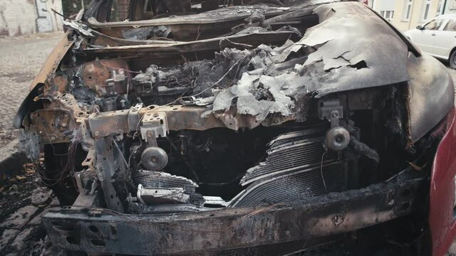 Burnt car engine handheld footage