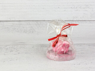 New Year gift of a pig in a package on a gray background