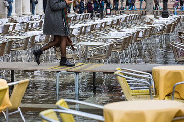 tables and chairs on the flooded San Marco 