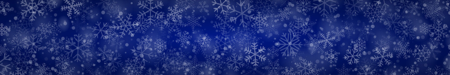 Obraz na płótnie Canvas Christmas banner of snowflakes of different shapes, sizes and transparency on blue background