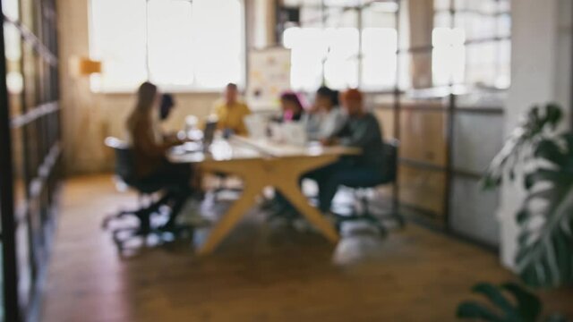 Startup business background. Blurred shot of creative team working at office