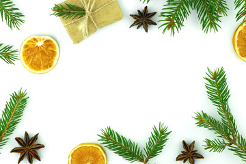 Christmas Happy New Year background. Spruce gift orange anise on white isolated background. View from above. Flat lay. Place for your text greeting