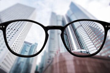 Looking through glasses to city buildings. Color blindness glasses, Smart glass technology
