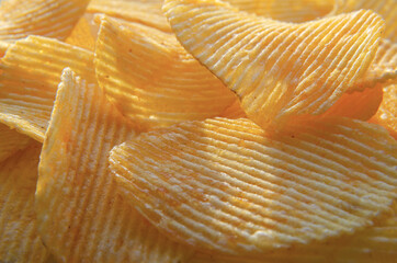 corrugated yellow chips on a background of sunlight