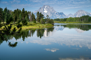 Fototapeta na wymiar Daytime, sunshine view of the Grand Tetons from Oxbow Bend and the Snake River