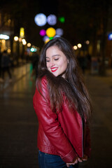 Girl going for a walk through Donostia-San Sebastian with the illuminations for Christmas.