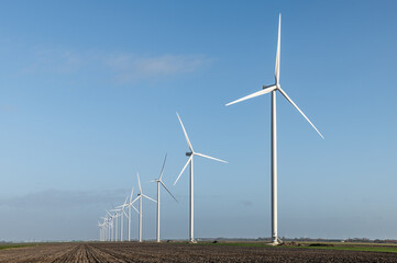 Giant wind turbine in dutch landscape