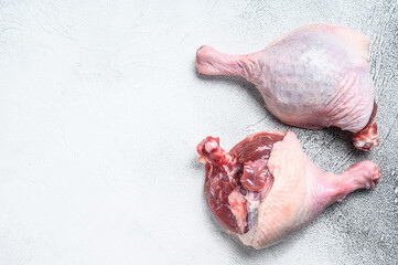 Free range raw Duck legs.  White background. Top view. Copy space