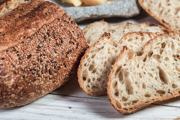 Various rustic bread on a wooden board. Healthy food and farming concept