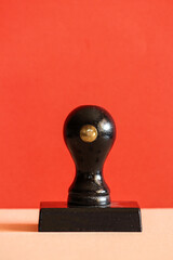 Stamp on a light red background