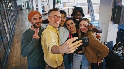 Casual business team taking collective photo on cellphone during break in office, smiling at camera together - Powered by Adobe