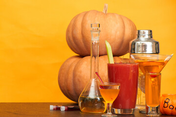 halloween bar cocktails party on orange background copy space