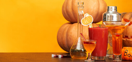 halloween bar cocktails party on orange background copy space