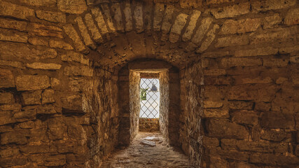 Interior of the old fortress tower. The window embrasures, thick walls.