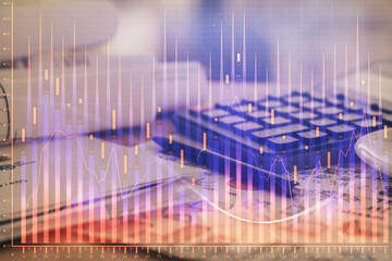 Double exposure of financial chart drawings and desk with open notebook background. Concept of forex market