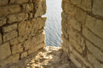 Interior of the old fortress tower. The window embrasures, thick walls.