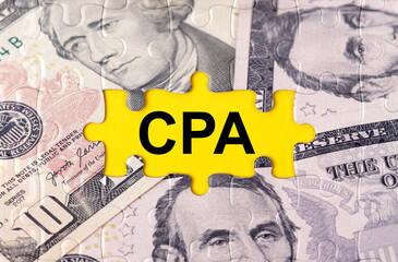 Puzzle with the image of dollars in the center of the inscription -CPA