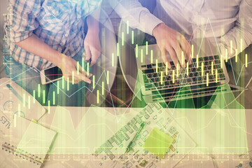 Multi exposure of man and woman working together and forex graph hologram drawing. Financial analysis concept. Computer background. Top View.