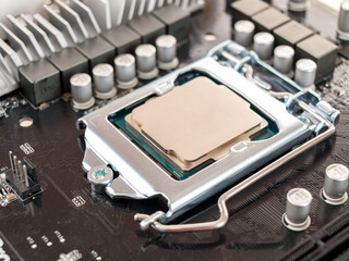the process of connecting the CPU to the processor socket on a modern computer motherboard,...