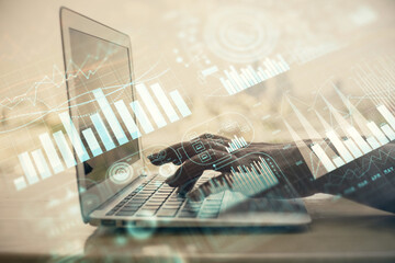 Double exposure of woman hands typing on computer and forex chart hologram drawing. Stock market invest concept.