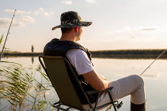 A Man Fishing On The Dock