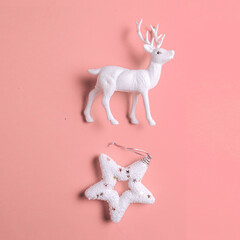 Christmas white star and reindeer toy on pastel  background.