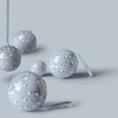 pastel Christmas decoration balls on soft blue background. Minimal New year concept with creative copy space.