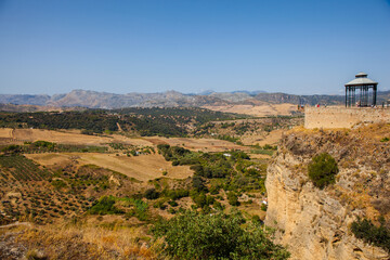 Fototapeta na wymiar Andalusia landscape, countryside road and rock in Ronda, Andalusia, Spain.