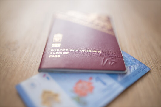 Sweden Passport Covering Part of a One Malaysian Ringgit Note