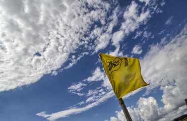 Kashubia Region - a flag against the sky with clouds - Poland