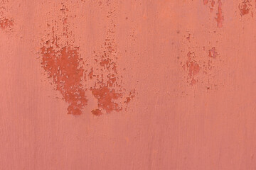 Texture in red. Matte surface. There is a patch on the texture, old texture with damaged paint. Texture with smudges of paint, cracked material from time and old age.