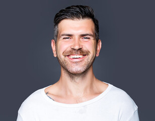 Obraz premium Portrait of happy smiling unshaven handsome man.