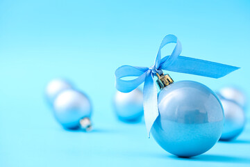 Beautiful Christmas balls on light blue background. Space for text