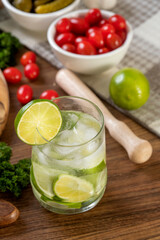 Caipirinha, typical Brazilian cocktail made with lemon (selective focus; close-up shot)