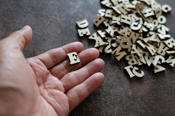 letter e in hand