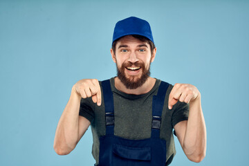 Fototapeta premium man in work uniform uniform professional work lifestyle delivery service blue background