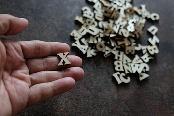 Fototapeta premium letter x in hand