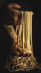Person holding fresh pasta