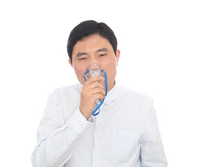 The male in front of a white background is doing atomization