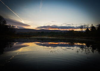 sunrise over the forest and lake