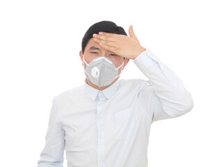 A man wearing a mask touched his forehead and suspected a fever