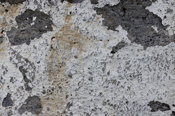 Old wall with cracked stucco. Weathered rough surface. Vintage texture great for background and design.