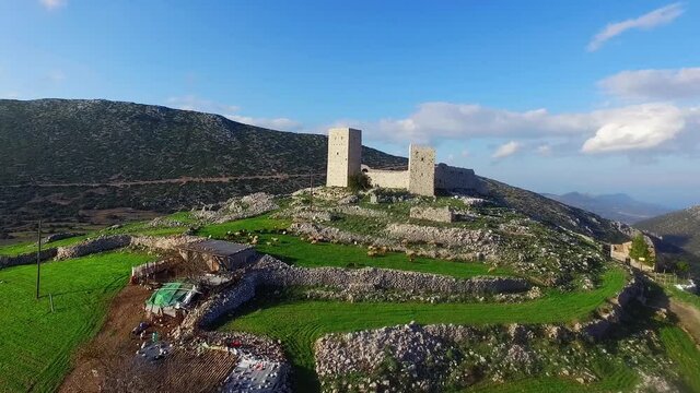 The castle of Morosini (Agionori) at Aghios Ioannis, Corinthia, Greece, on a verdant hill and in a very clear atmospehere