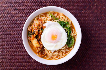 Korean food, Spicy noodles soup with kimchi and egg, Top view
