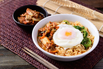 Korean food, Spicy noodles soup with kimchi and egg, Top view