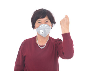 Women wearing masks make fists and make cheering gestures