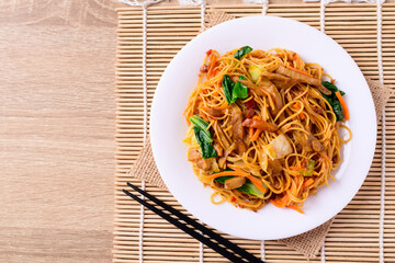 Asian food, vegetarian stir fried noodles with mushroom and vegetables, Top view