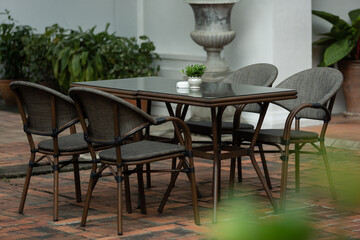 Patio furniture in a beautiful garden.