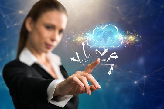businesswoman interacting with a virtual cloud in front of blue background