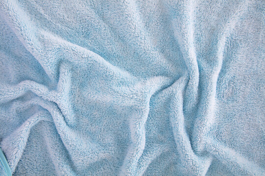 Blue plush bath towel fabric with wrinkled texture